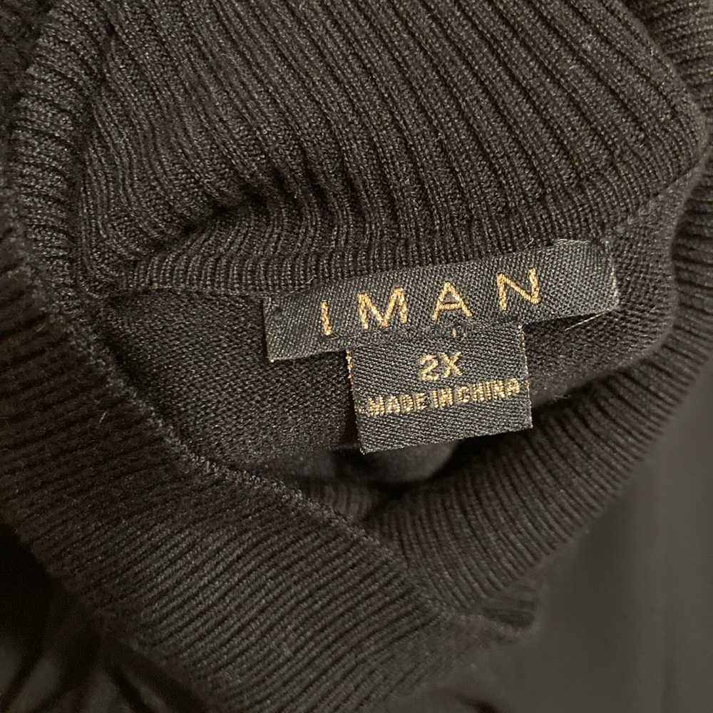 Iman 2X turtleneck with button sleeve details
